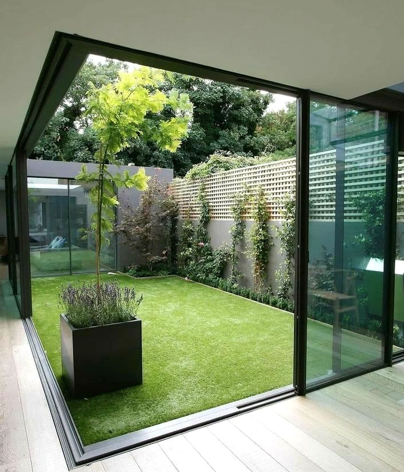 Refined courtyard view frames the composition with shape, making the scene feel soft at the edges.
