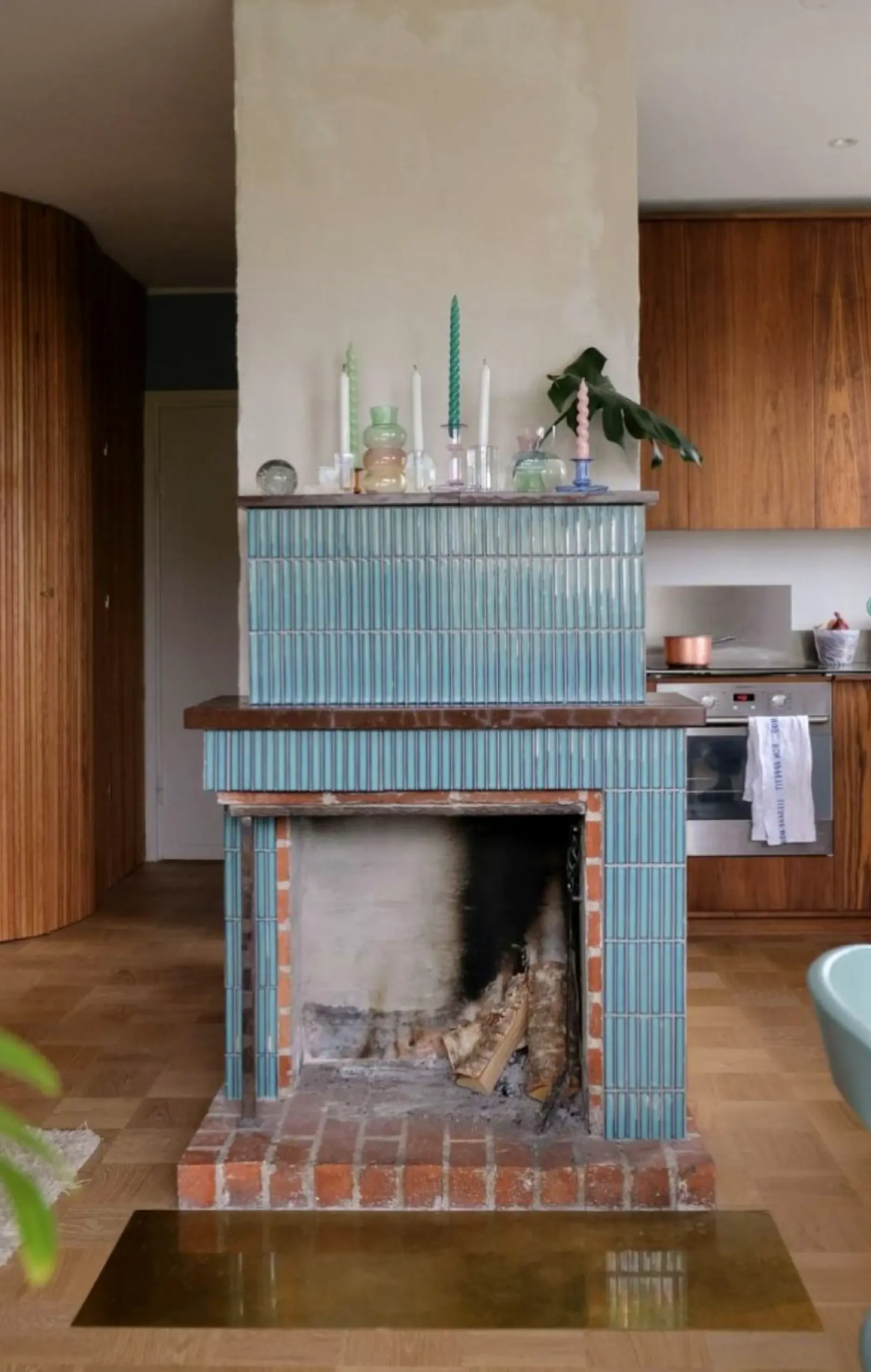 Sculptural decorative mirror frames the corner with freshness, making the scene feel open and lived-in.