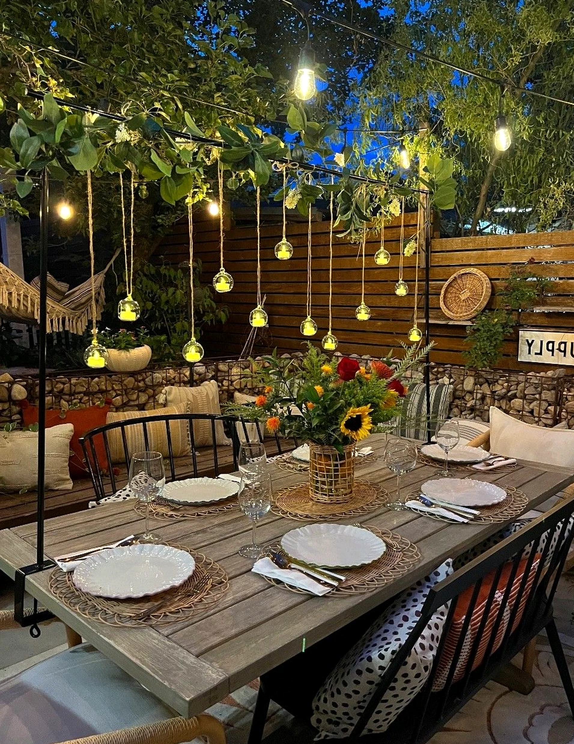 Airy dining setup adds a clear layer of balance, helping the garden edge feel settled and welcoming.