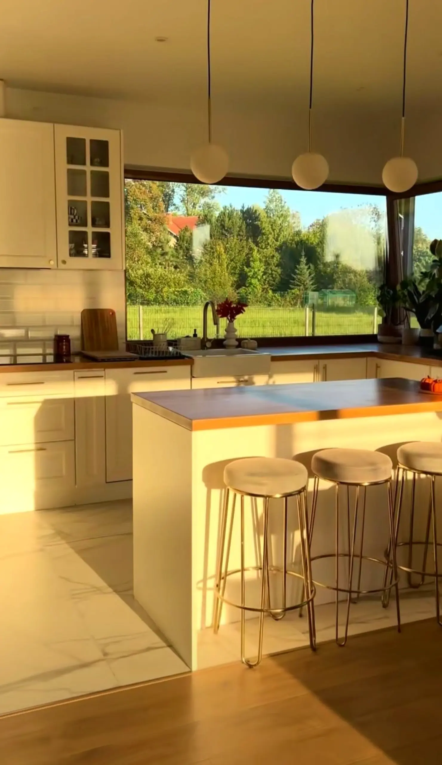 Natural soft sofa adds a clear layer of personality, helping the view feel bright but not busy.
